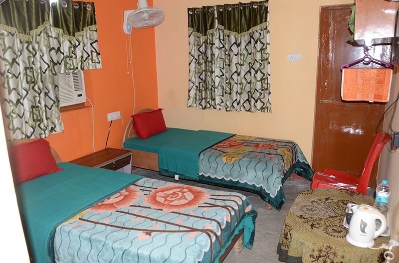 Deluxe Room with balcony curtains and double bed