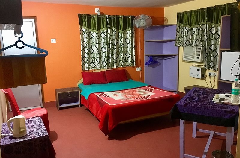 Executive Deluxe Room with double bed and seating area